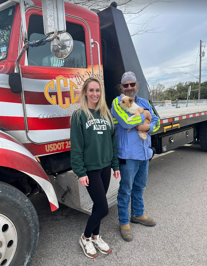 Kelsy Johnson, Director of Customer Service with Austin Pets Alive, receiving truck load of supplies by CC Carlton driver, Brian Thomas.